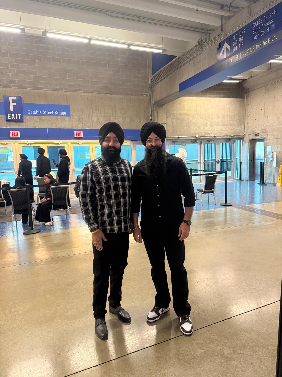 Sikh turban tying - black turbans at Cambie Street Bridge